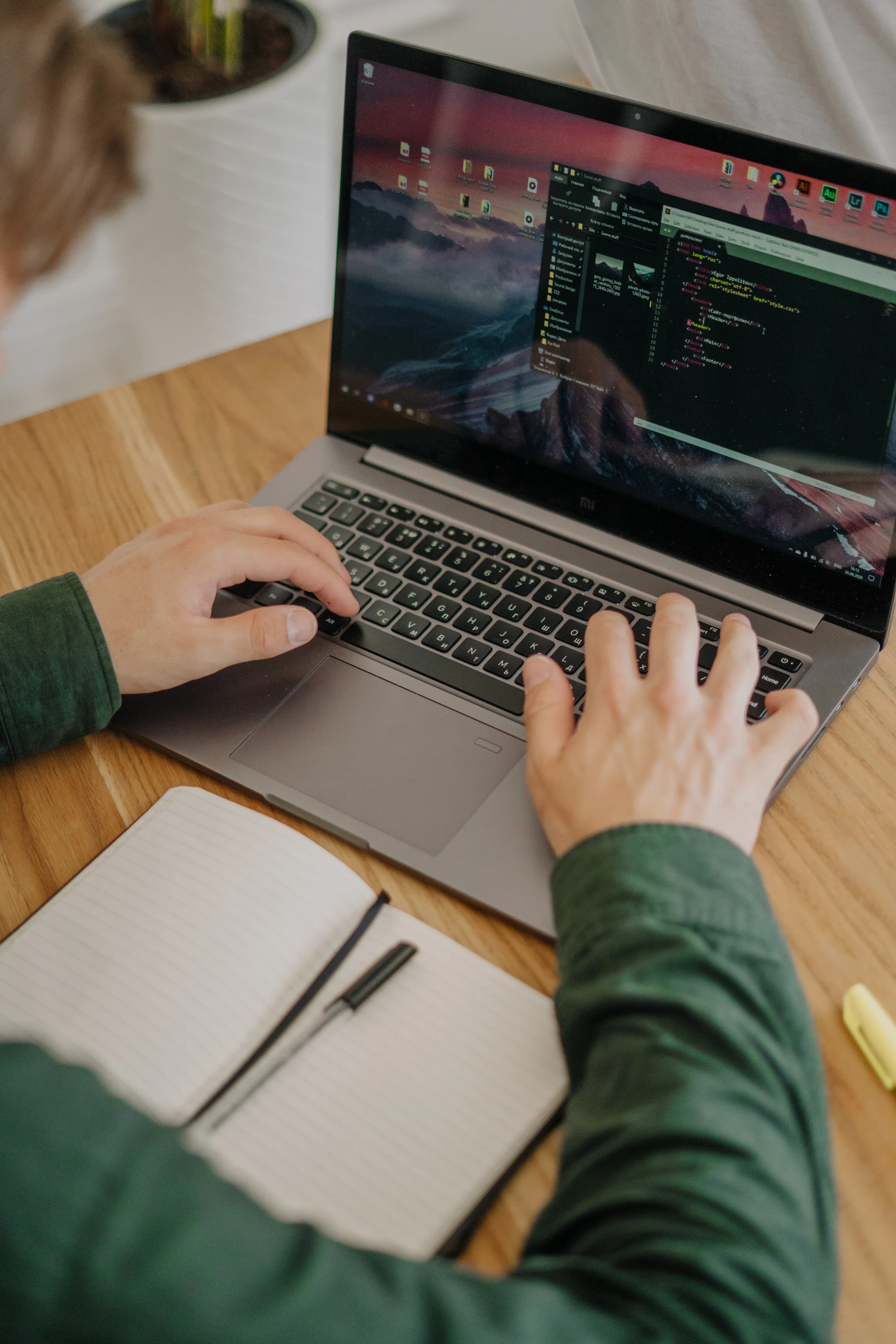 A software developer and client working together at a desk, representing ongoing software maintenance and support