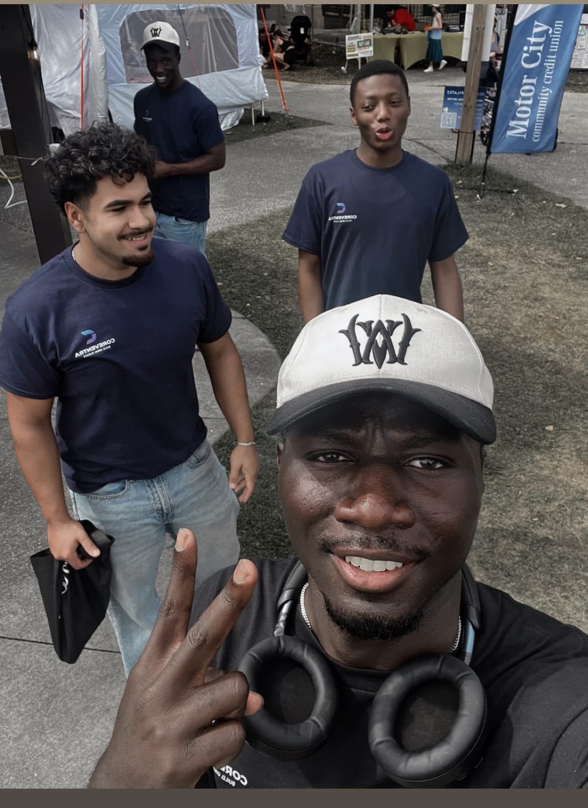 Coreventra team members together at a Windsor-Essex market appearance, wearing branded shirts